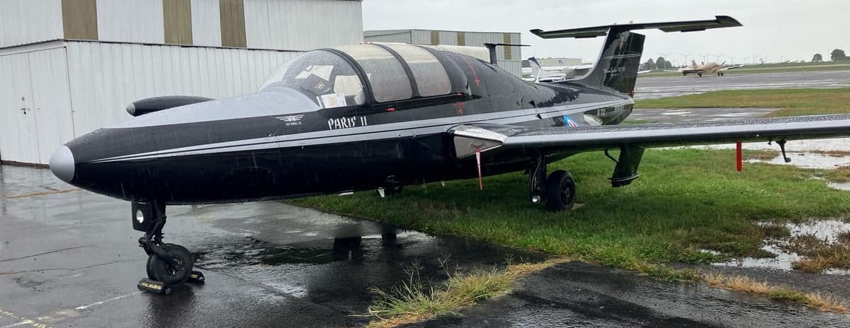 A Fouga CM.170 Magister, also known as a Paris II, parked on the tarmac.