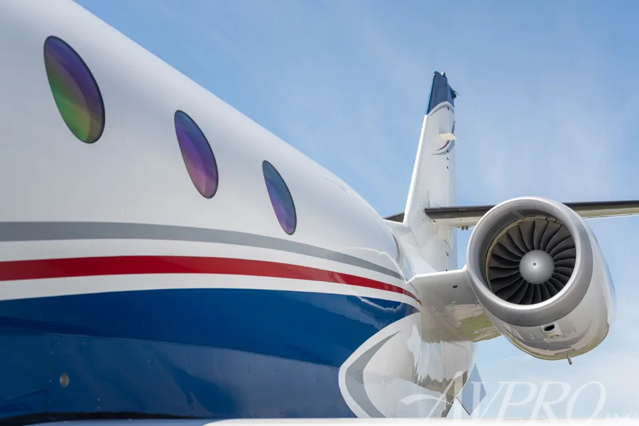 A close-up view of the rear fuselage and engine of the Gulfstream G200 business jet.