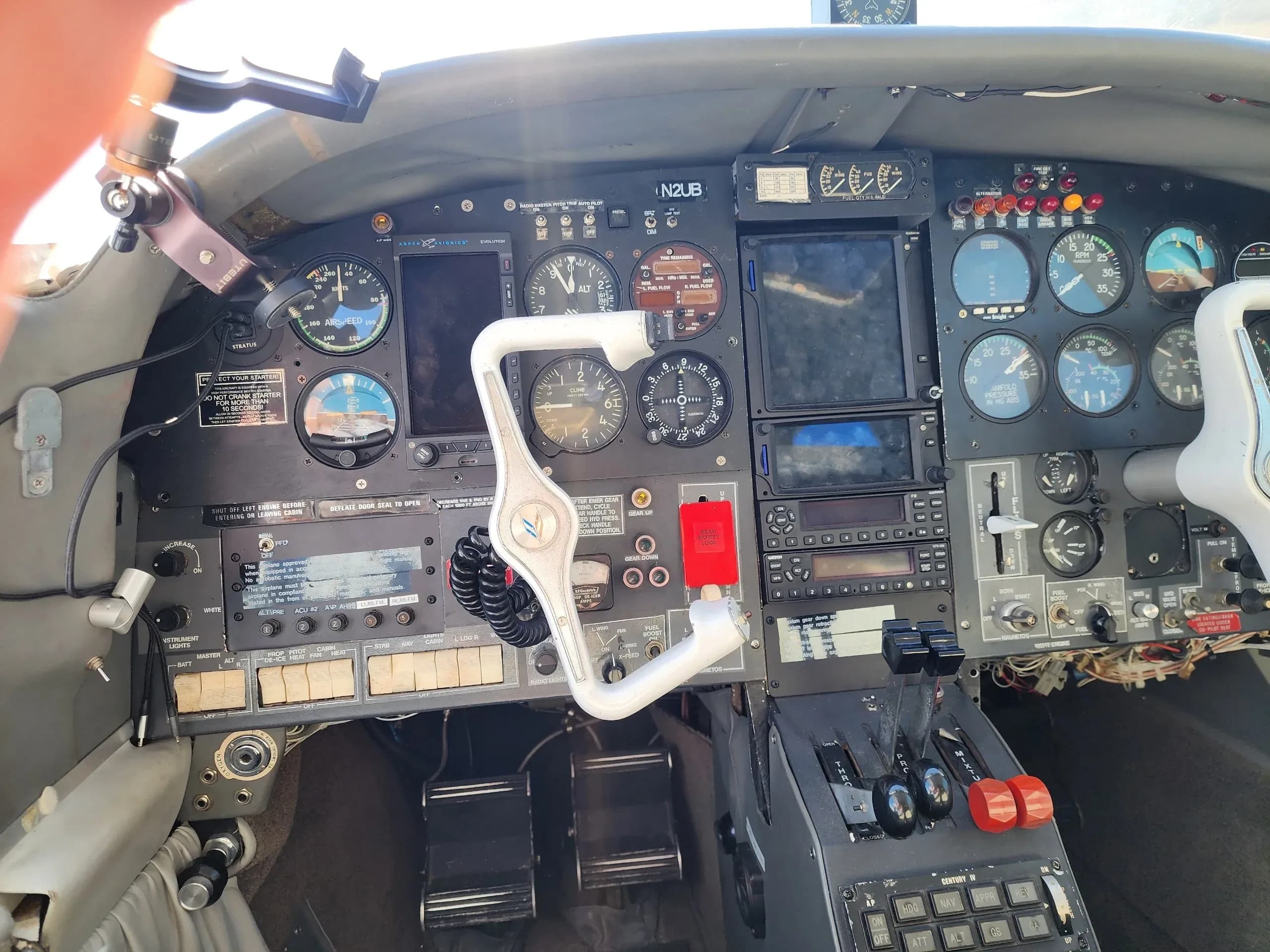 Wide view of the cockpit instrument panel and controls of the N2UB aircraft.