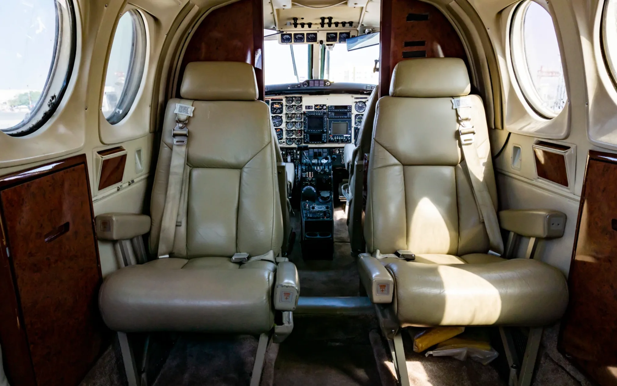 Interior view of the Beechcraft King Air 200 cabin showing seats and cockpit.