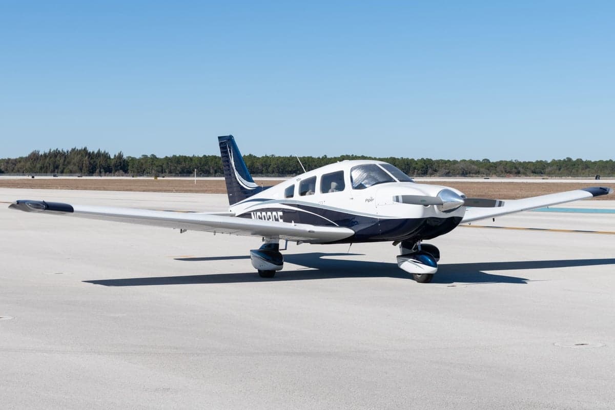 Front view of the Piper Archer LX N603CE on the tarmac.