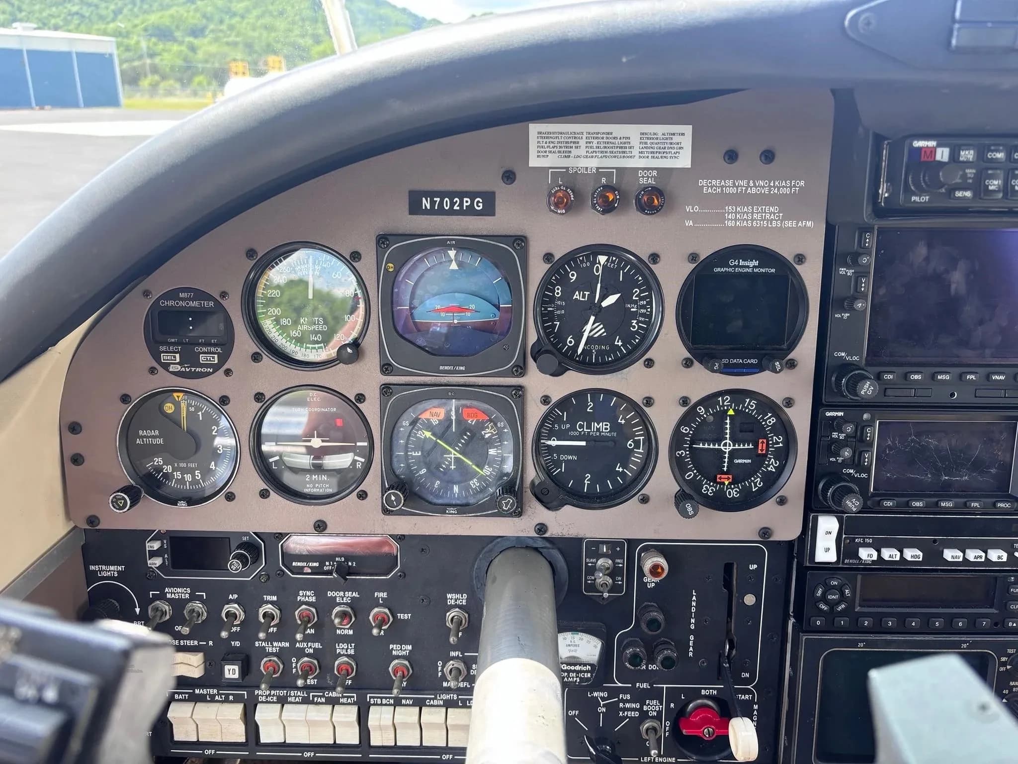 A close-up view of the pilot's side instrument panel in the Aerostar aircraft (N702PG).