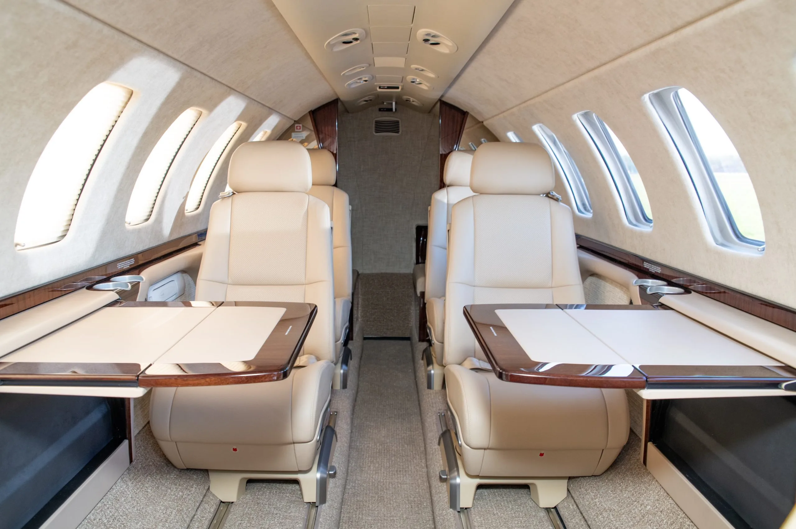 Citation CJ3+ aircraft with a blue and gold paint scheme on the tarmac.