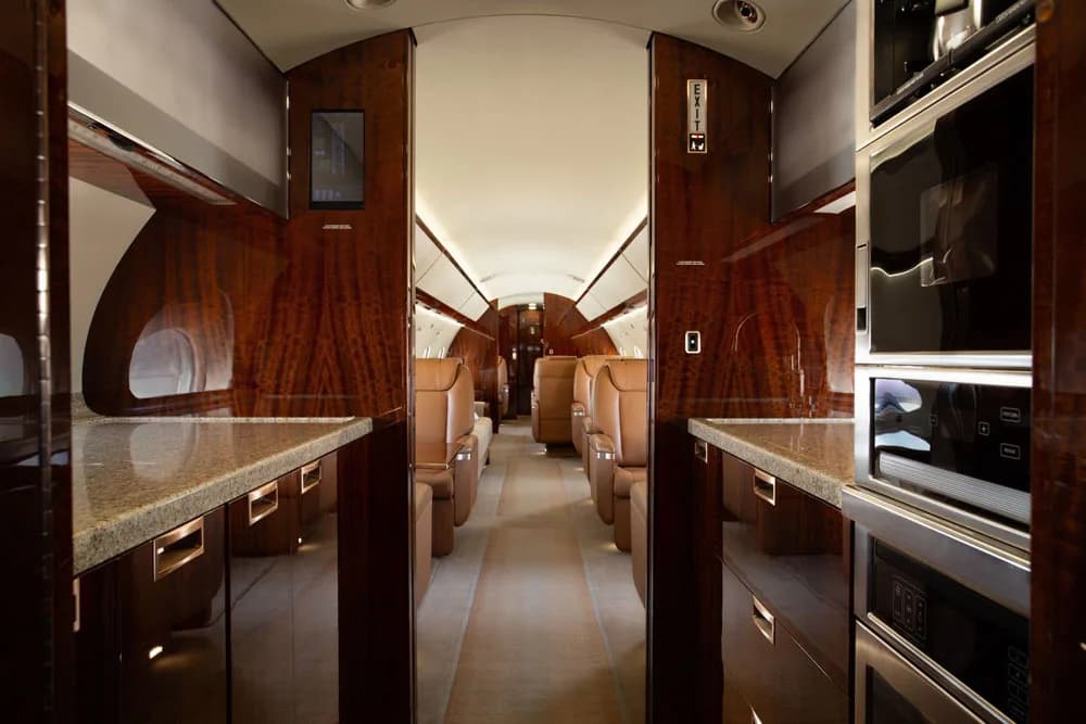 View down the aisle of the aircraft cabin.