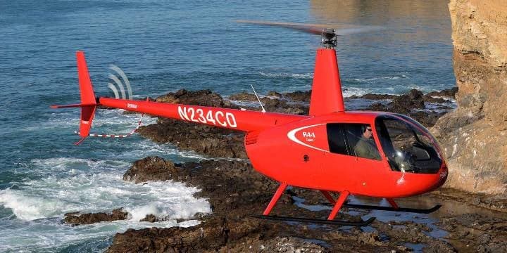 Robinson R44 Cadet brochure with cockpit and exterior views.