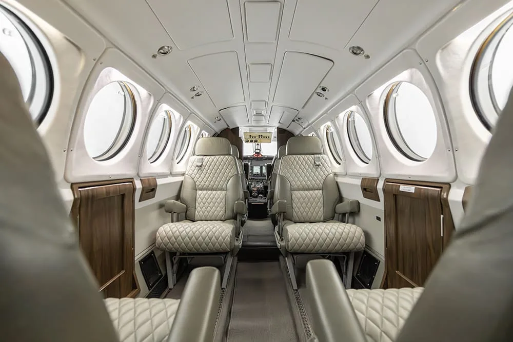 Interior view of the King Air aircraft showing the seating arrangement and cabin layout.