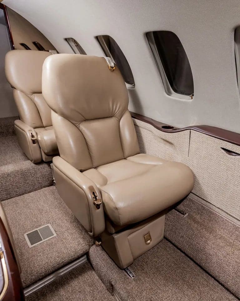 View of the aircraft interior showing two passenger seats.