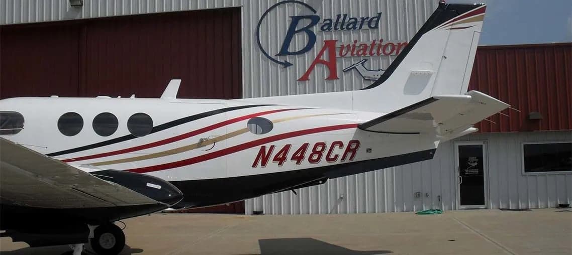 The tail of a Beechcraft King Air with the tail number N448CR.