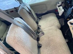 Sheepskin seat covers on the front seats of the aircraft.