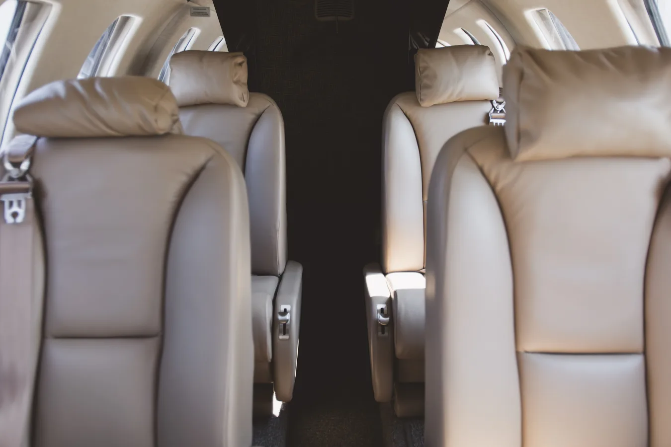 Close up of the aircraft cabin seats with headrests.