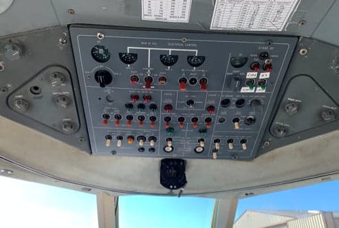 Close-up of the aircraft's electrical control panel in the cockpit.