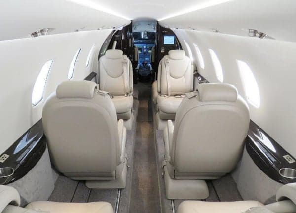 View of the aircraft's interior cabin with leather seats.