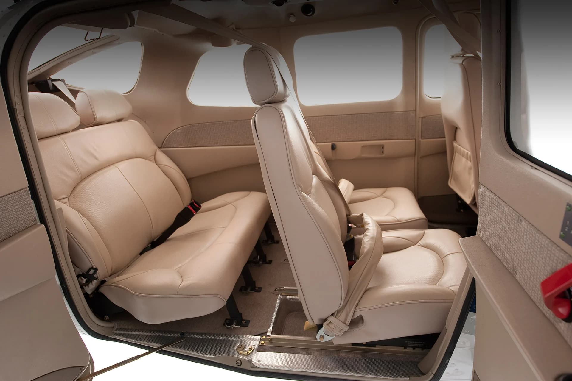 The interior of a Cessna Stationair with tan leather seats.