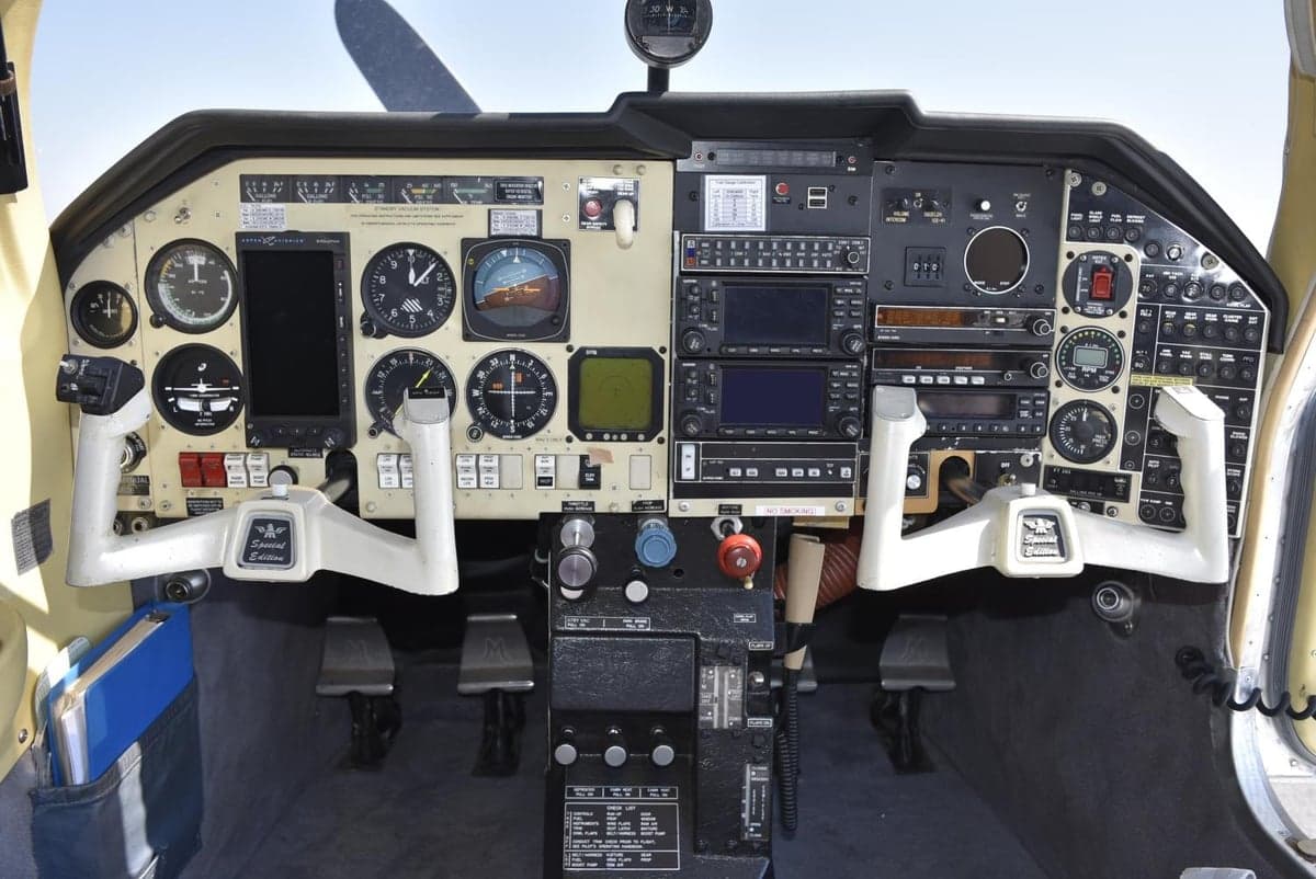 Full view of the aircraft's instrument panel and control yokes from the pilot's perspective.