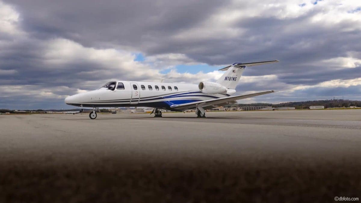 N181WS Cessna Citation CJ3+ on the tarmac with a cloudy sky in the background.