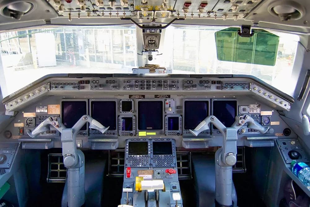 Detailed view of the aircraft's cockpit instrument panel and controls.
