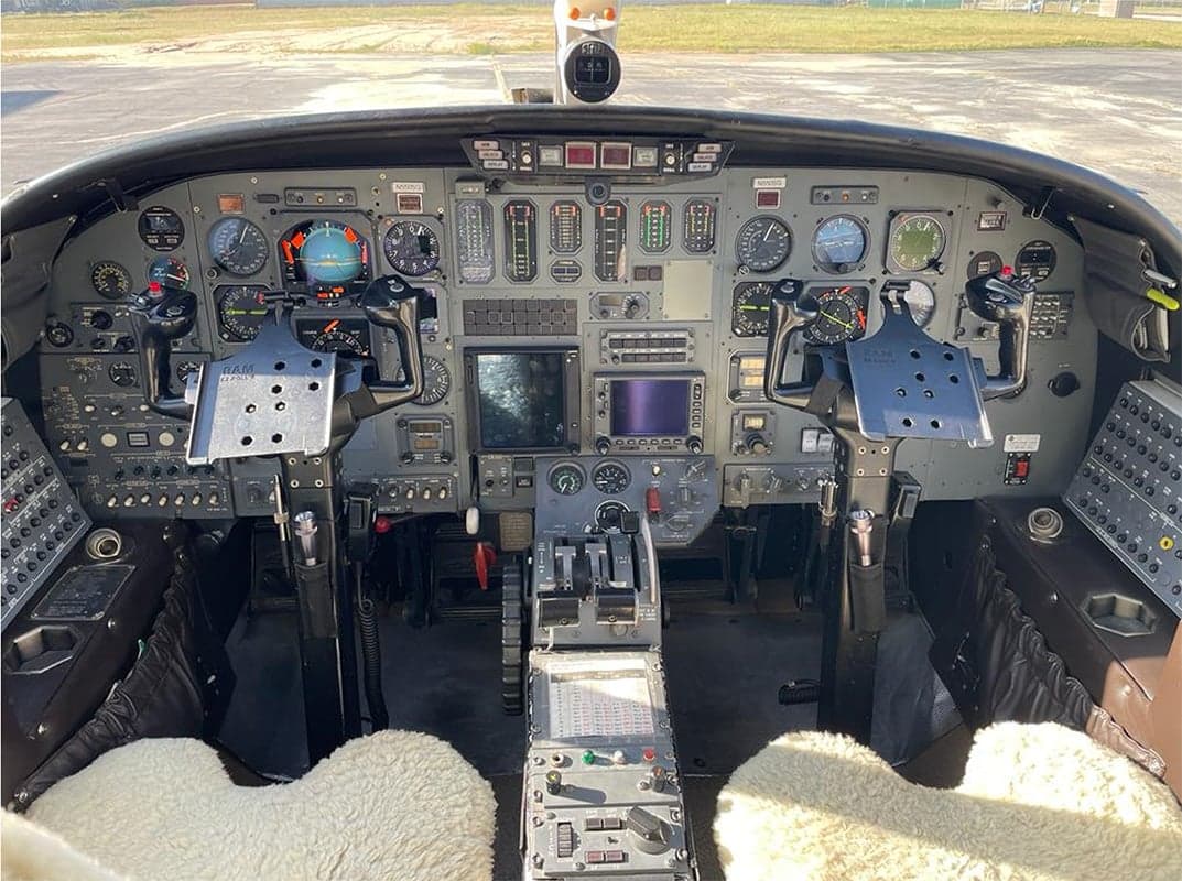 The cockpit of a Cessna Citation CJ3 features a full instrument panel and dual control yokes.