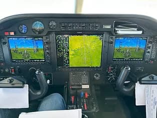 View of the instrument panel in the cockpit of an aircraft.