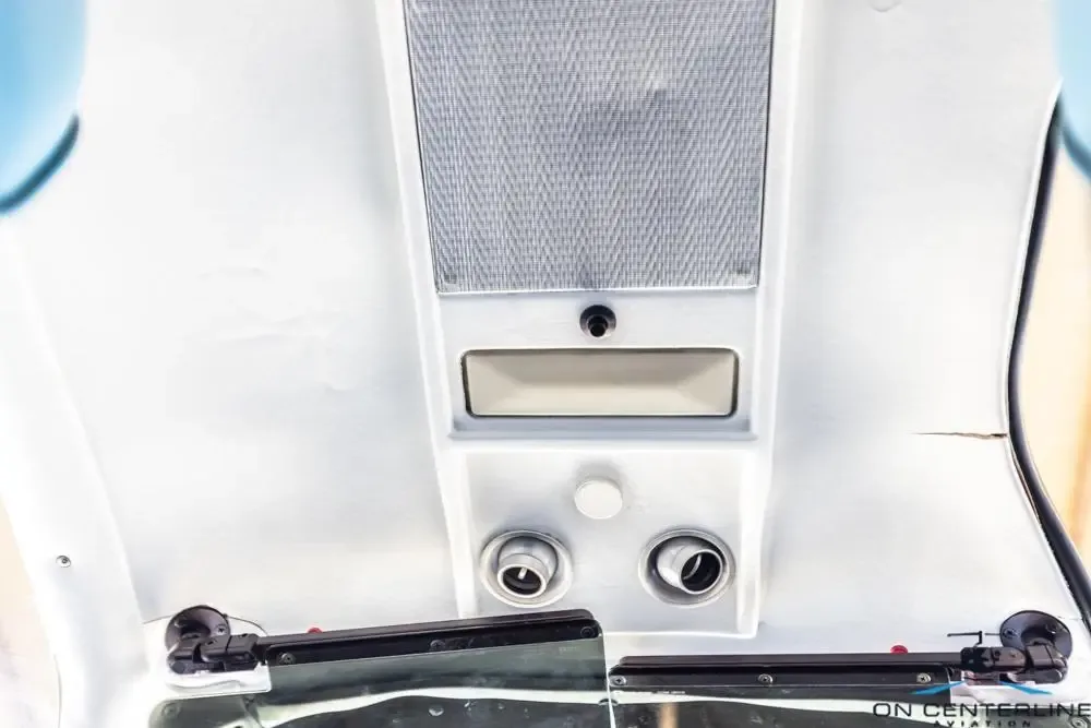 Close-up of the interior ceiling and sun visors of the aircraft.