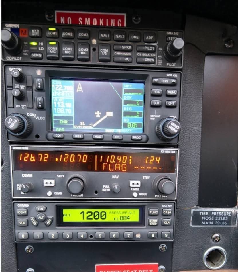 Close-up of the aircraft's avionics stack, including GPS and radio controls.