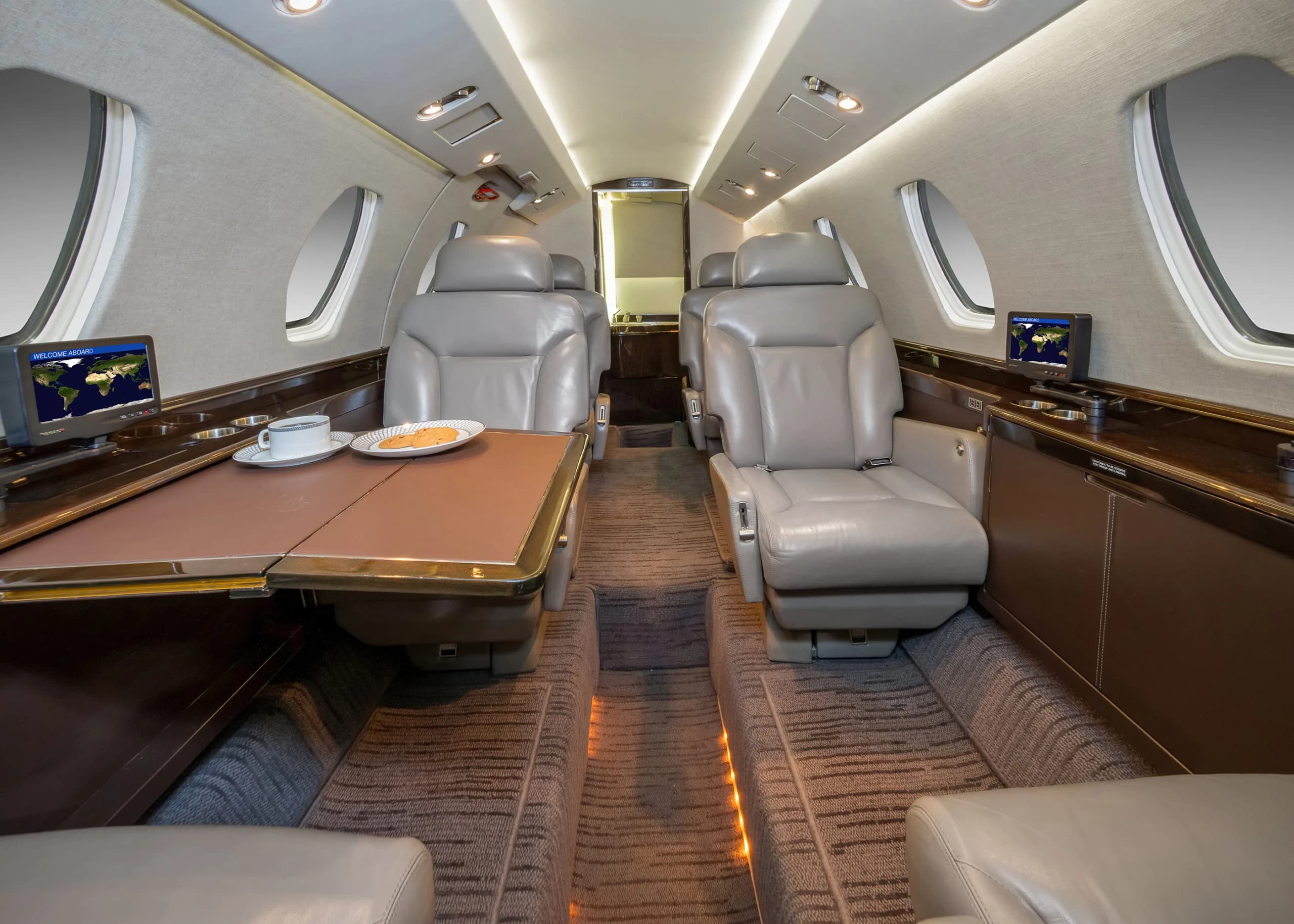 View of the cabin interior showing seats and table.