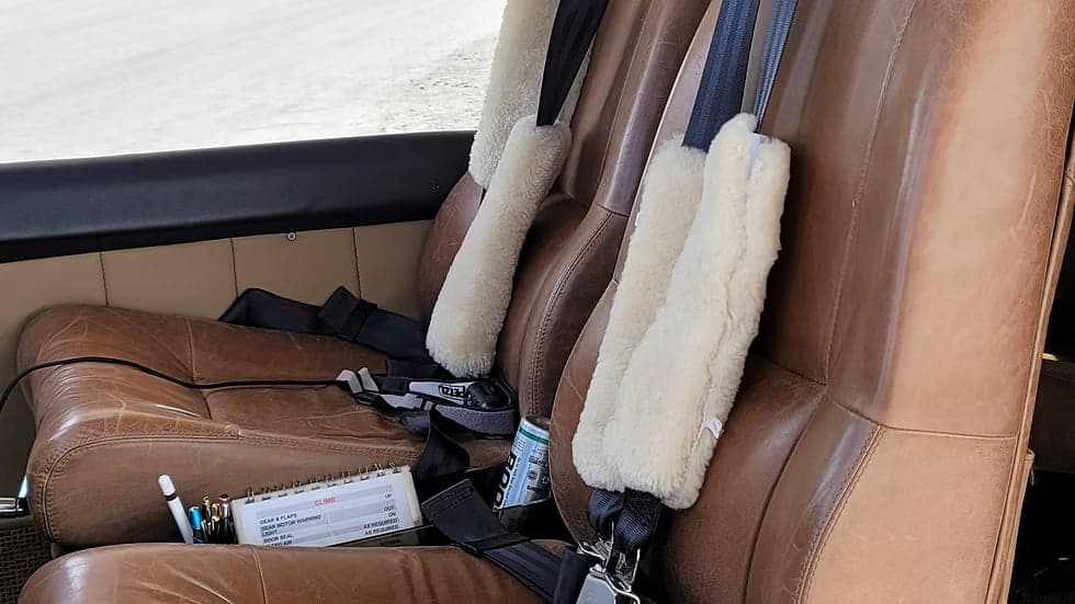 Close-up of the leather seats inside the N210NL aircraft.