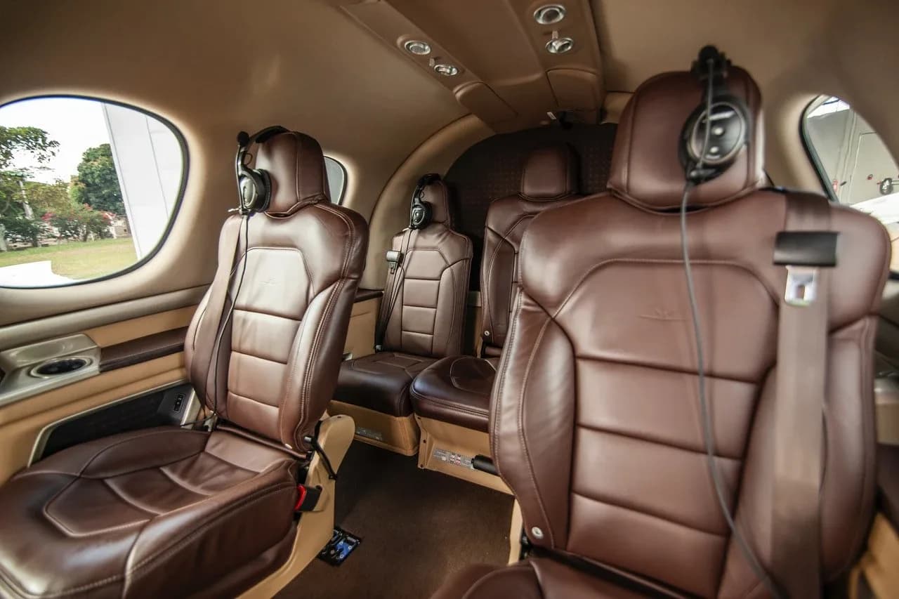 Another view of the brown leather passenger seats in the cabin of a Cirrus Vision Jet.