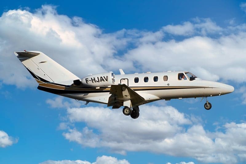 F-HJAV aircraft in flight with landing gear down.