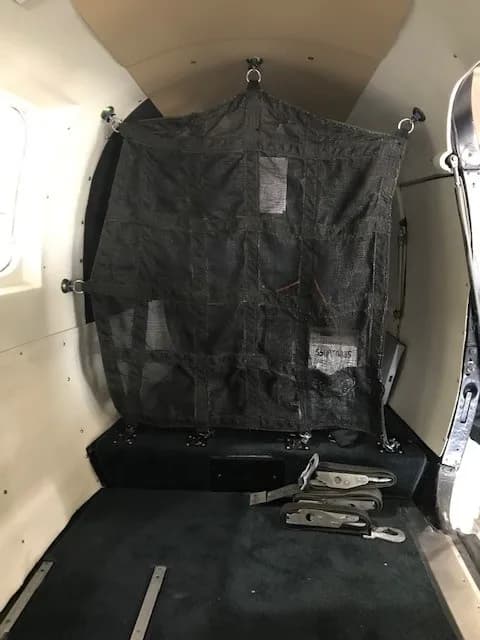 Close-up of cargo netting inside the aircraft.