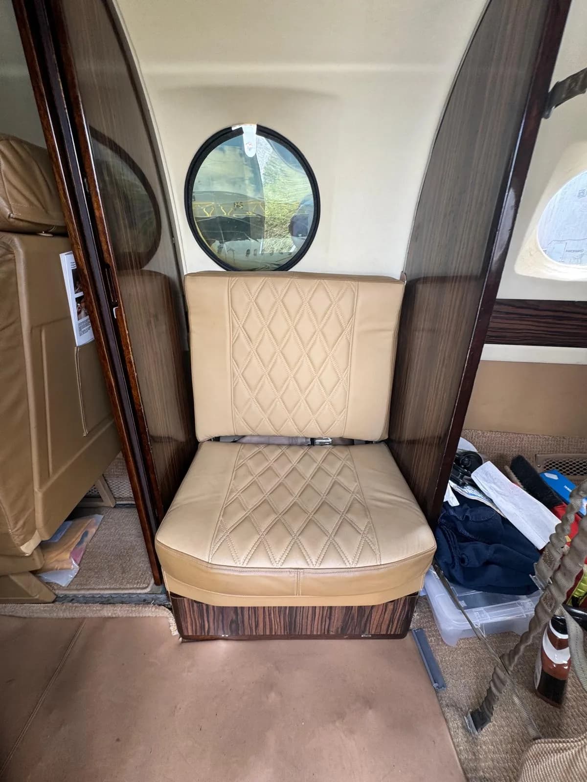 Interior view of the King Air 200 cabin with tan leather seats.