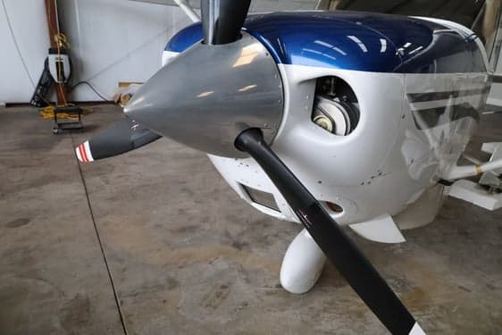 Close up of the propeller and nose of a turboprop aircraft.