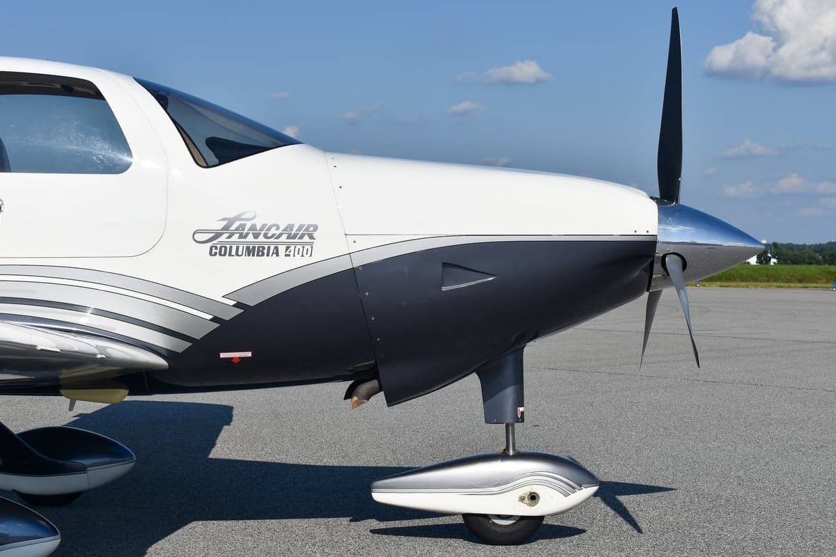 Close-up of the Lancair Columbia 400 logo on the aircraft's exterior.