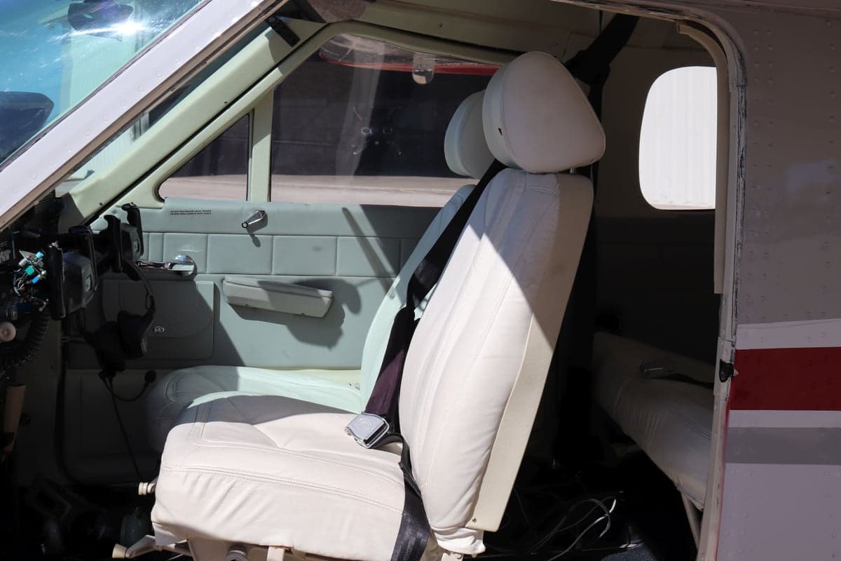 View of the front seat and cabin interior from the doorway.