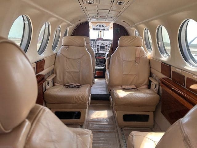 The interior of the King Air 350 features leather seats and a spacious cabin.