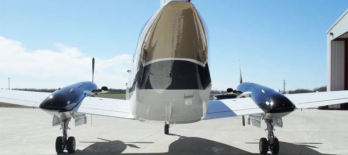 Front view of a King Air aircraft showing the nose and wings.