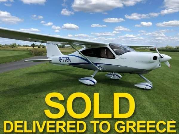 A white light sport aircraft with registration G-TTEN is parked on a grassy field with the word SOLD overlaid.