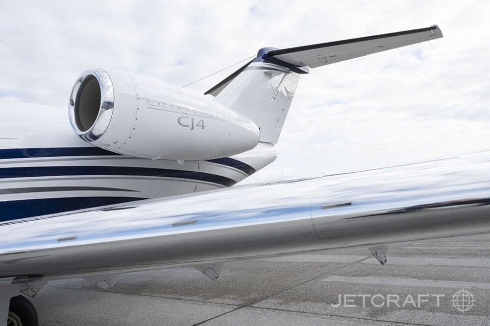 Close up of the tail and engine of a CJ4 aircraft.