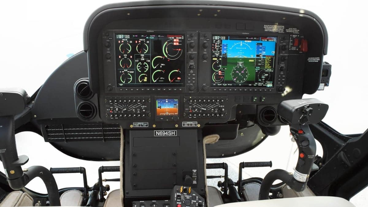 The cockpit of the AgustaWestland AW119 Koala helicopter features a modern glass panel display.