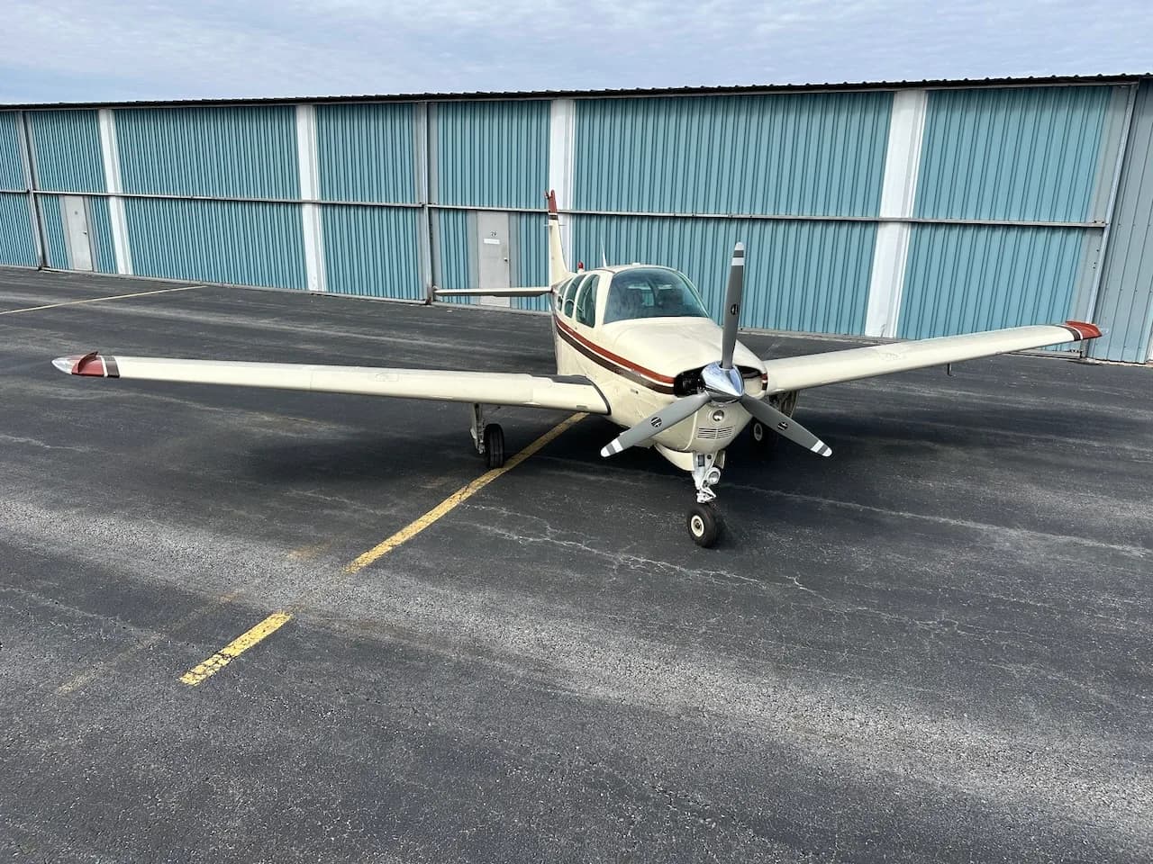 Front view of a Beechcraft Bonanza N1550D on the tarmac.