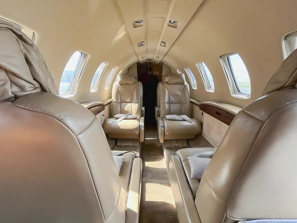 A view of the interior cabin of the aircraft, showing the seating arrangement and layout.