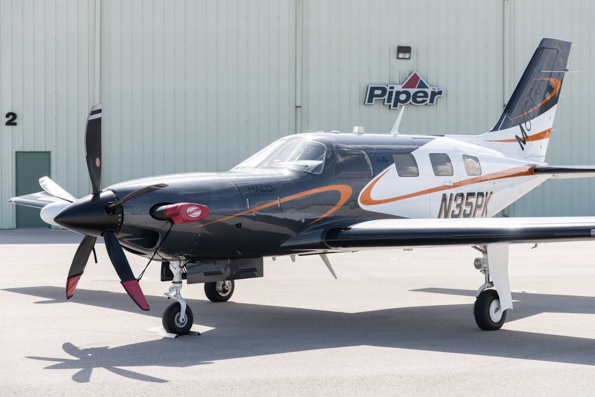 A close-up of a Piper M600 HALO, registration N35PK, parked on the tarmac.