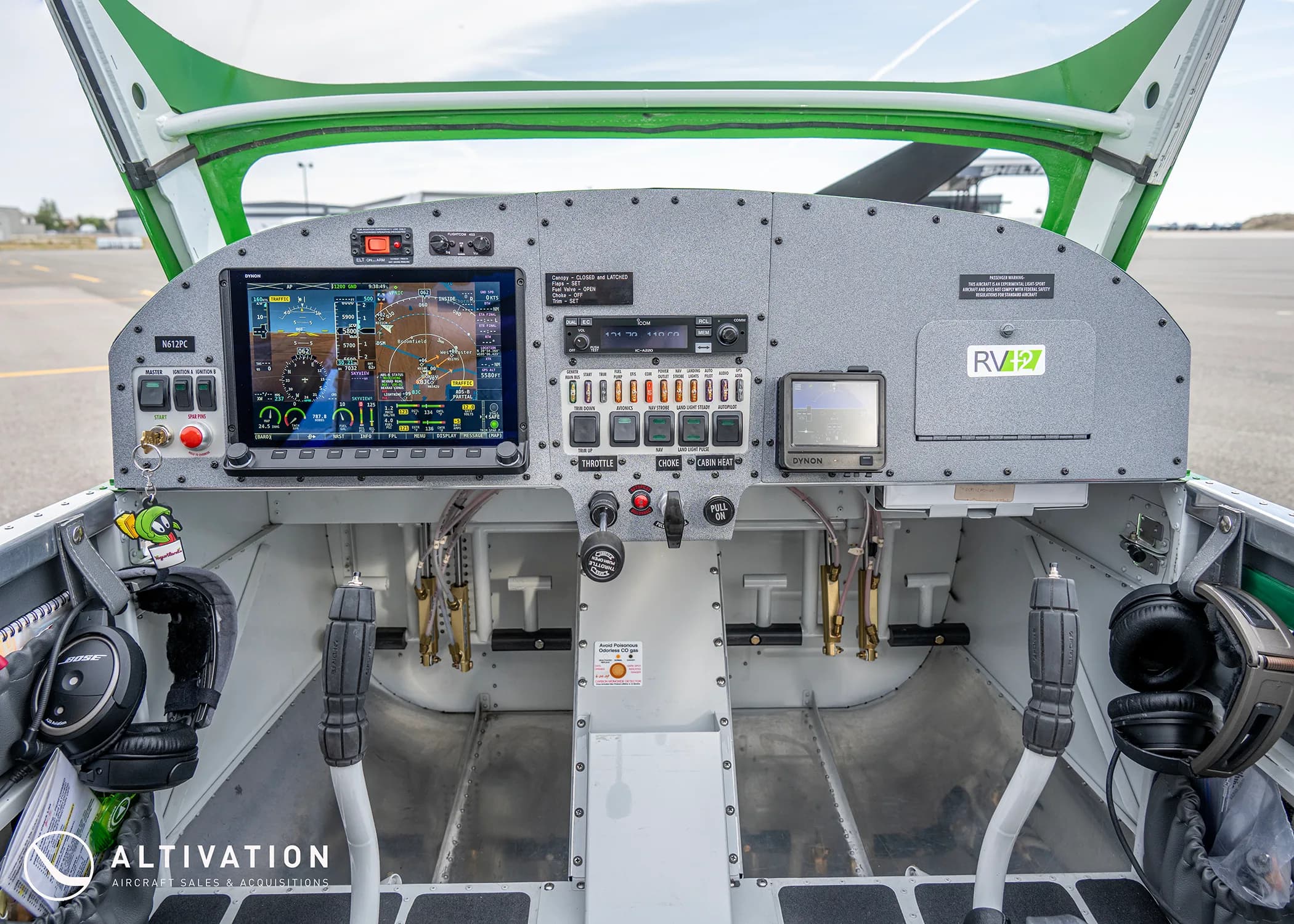 The cockpit of a Vans RV-12 aircraft, showing the instrument panel with a large digital display and controls.