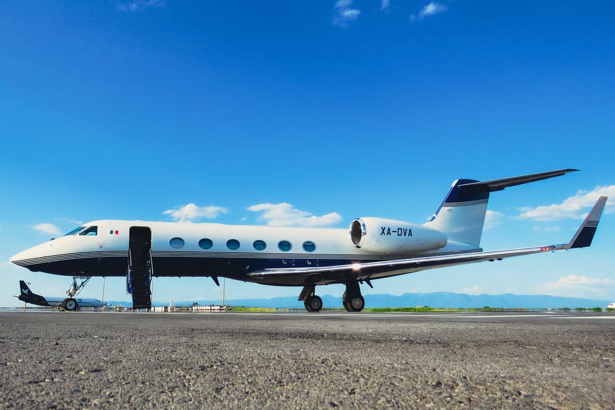 XA-OVA aircraft parked on the tarmac with stairs extended.
