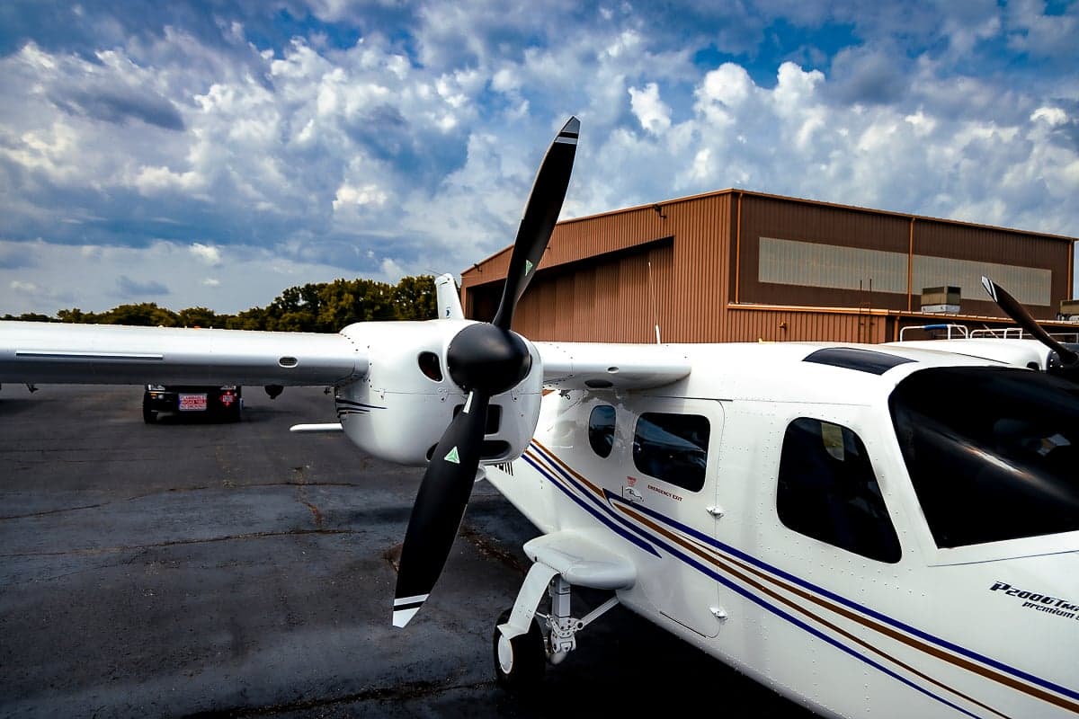 Close-up of the propeller and nose of a Tecnam P2006T aircraft.