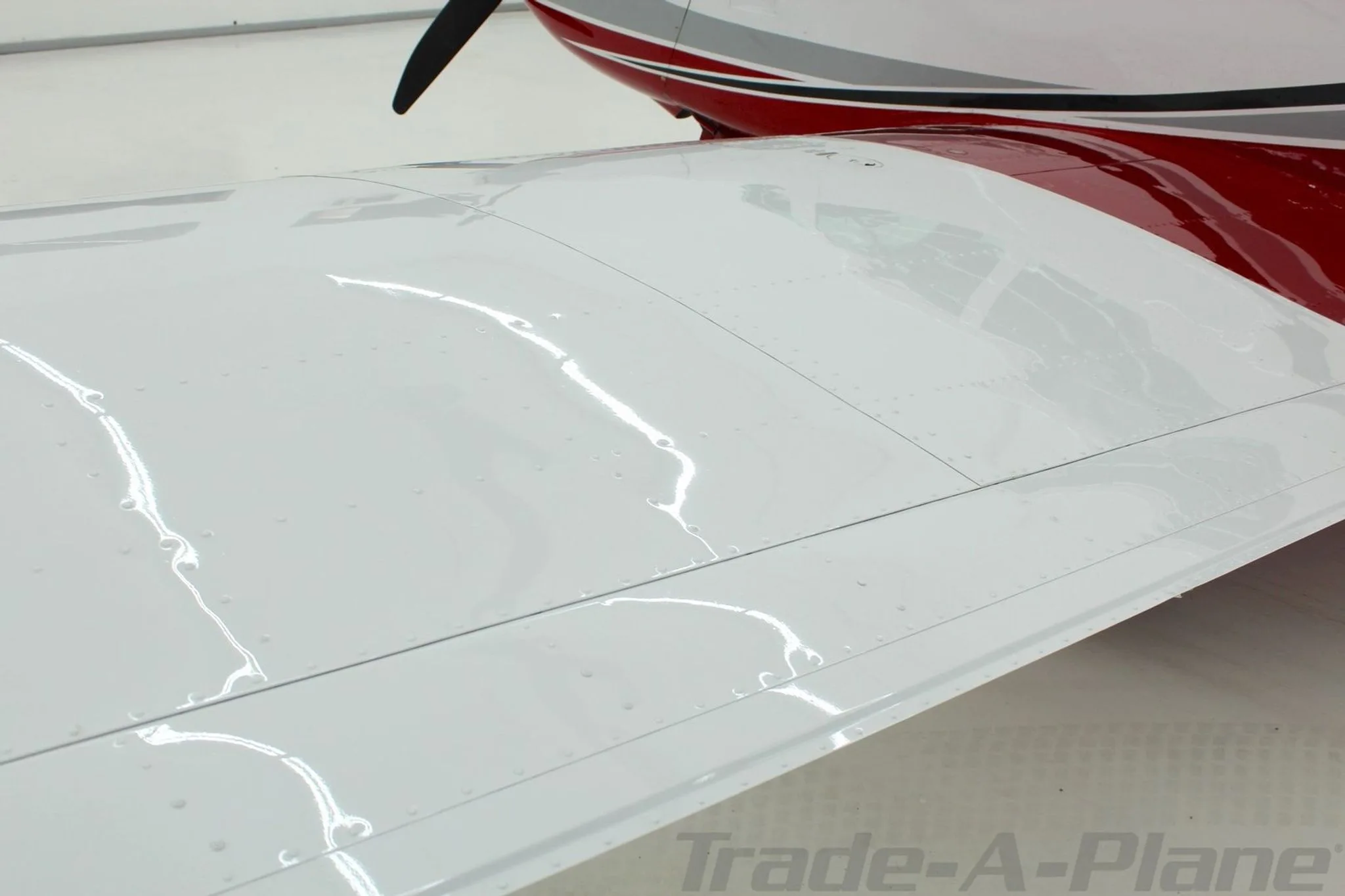 A detailed view of the right wing surface of the Mooney N1039B.
