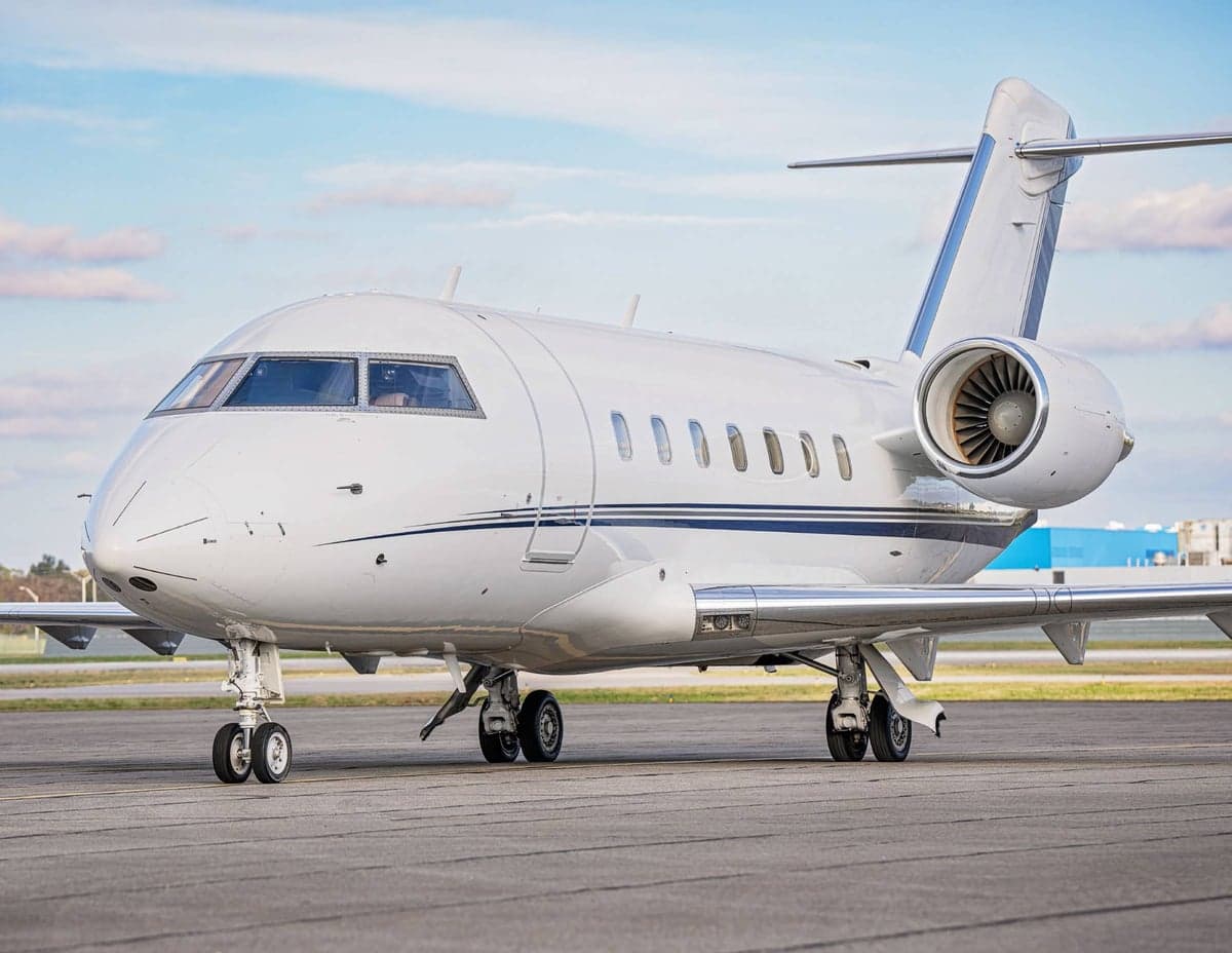 A Challenger aircraft is parked on the tarmac.