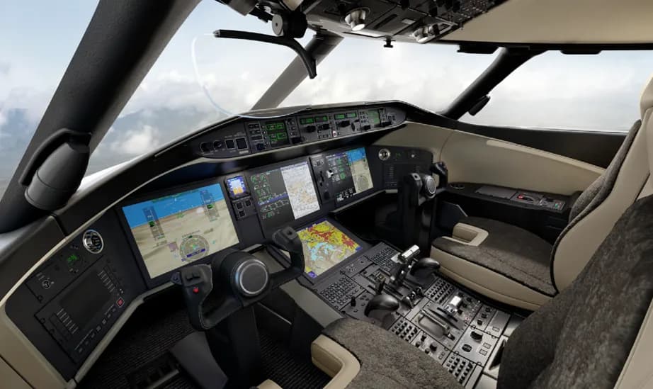 View of the aircraft cockpit with multiple display screens.