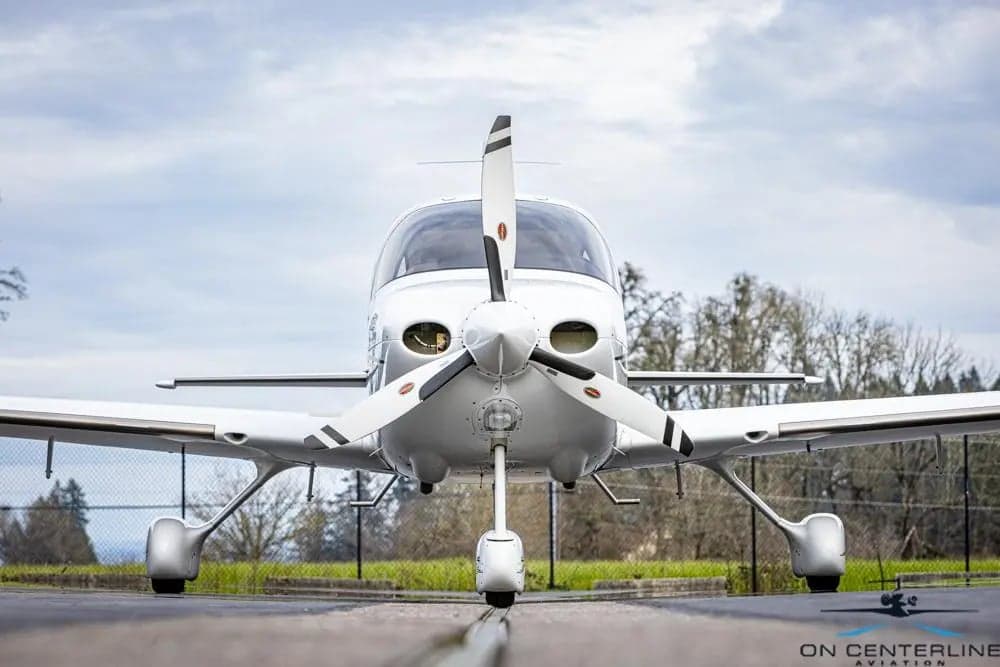 Front view of Cirrus SR22T aircraft N282CD on the tarmac.