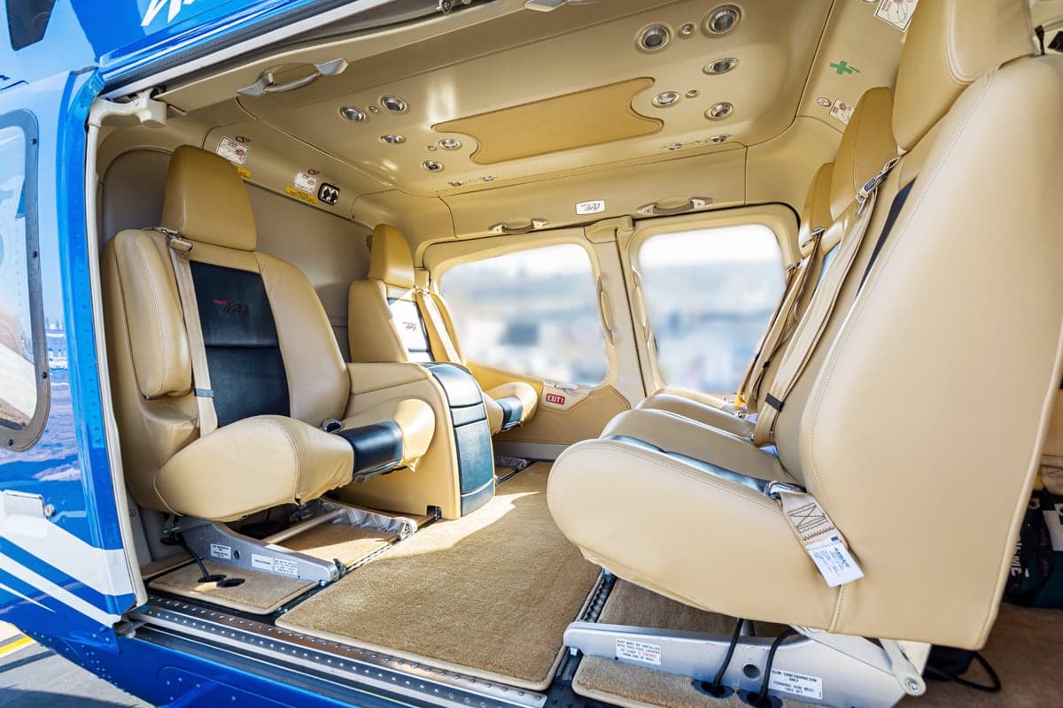 The interior of the Bell 429 helicopter with tan leather seats.