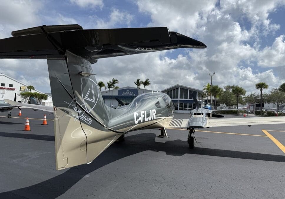 Rear view of a Diamond DA62 aircraft on the tarmac.